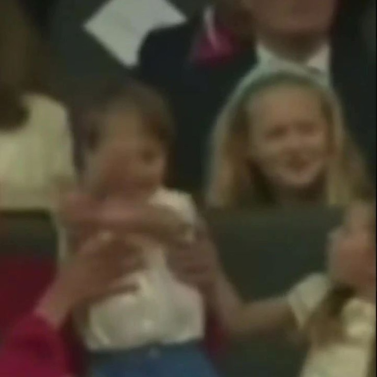 Louis stood on his chair waving at the parade, and his big sister tried to gently pull him back down into his seat. Picture: Instagram / Cambridge.edits