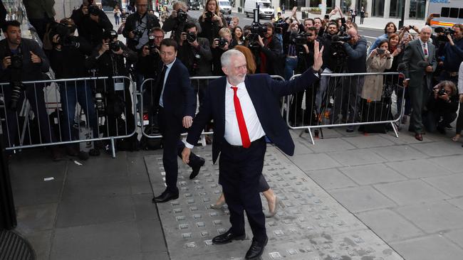 Britain's Opposition Jeremy Corbyn waves as he arrives at Labour Party headquarters in central London on June 9, 2017 after results in a snap general election show a hung parliament with Labour gains and the Conservatives losing its majority. Picture: AF.