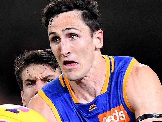 BRISBANE, AUSTRALIA - SEPTEMBER 14: Oscar McInerney of the Lions attempts to break away from the defence during the AFL Semi Final match between the Brisbane Lions and the Greater Western Sydney Giants at The Gabba on September 14, 2019 in Brisbane, Australia. (Photo by Bradley Kanaris/Getty Images)