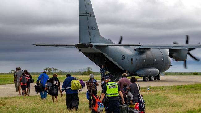 The Royal Australian Air Force assists residents from the Kalkarindji area being evacuated during major flooding in the Northern Territory.