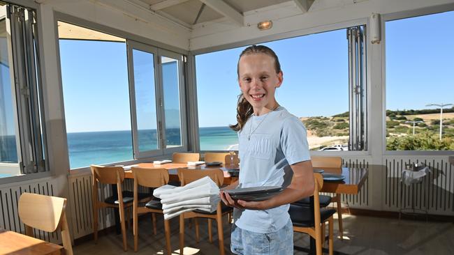 Maggie, 12, works about 4 hours a month at her family's restaurant, the Star of Greece. Picture: Keryn Stevens