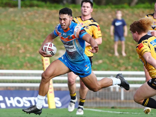 Pride's Jensen Taumoepeau gets past Caius Faatili in the Hostplus Cup Queensland Rugby League (QRL) match between the Northern Pride and the Sunshine Coast Falcons, held at Barlow Park, Cairns Picture: Brendan Radke