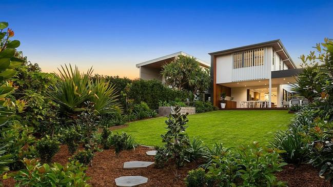 Beautiful greenery surrounds this architecturally-designed abode.
