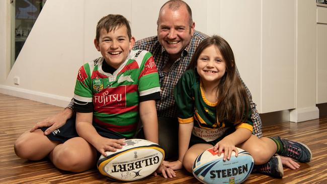 Jamie Cullen, with his children James and Olivia, agrees transgender children should not be discriminated against but is concerned about treating them different to peers. Picture: Monique Harmer