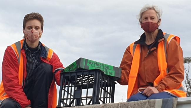 Annabell Gottwald and Sally-Anne Brown sit on top of a truck on Thursday. Picture: XR