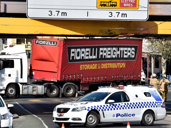 A truck got entangled in the tram lines on Racecourse Rd, Flemington. Picture: Jay Town.