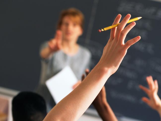 Teacher pointing to raised hands in classroom, Classroom, teaching generic, education generic, Teacher, Learning, Hand Raised, Education, Adult, School Building, Pointing, Standing, Image, Women, Adults Only, Colour Image, Horizontal, Human Arm, Human Body Part, Human Limb, Incidental People, Indoors, Limb, One Person, Only Women, People, Photography, thinkstock, generic, istock