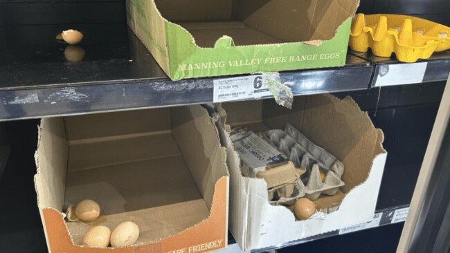 Shoppers are divided after seeing a photo of a supermarket shelf with cracked eggs smeared everywhere. Picture: Supplied