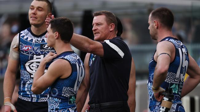 Michael Voss had a heated exchange with captain Patrick Cripps on the bench during the second quarter. Picture: Michael Klein