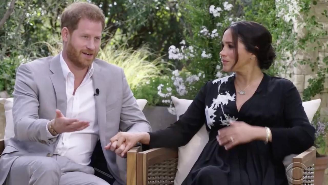 Harry and Meghan hold hands during their controversial interview with Oprah Winfrey. Picture: CBS.