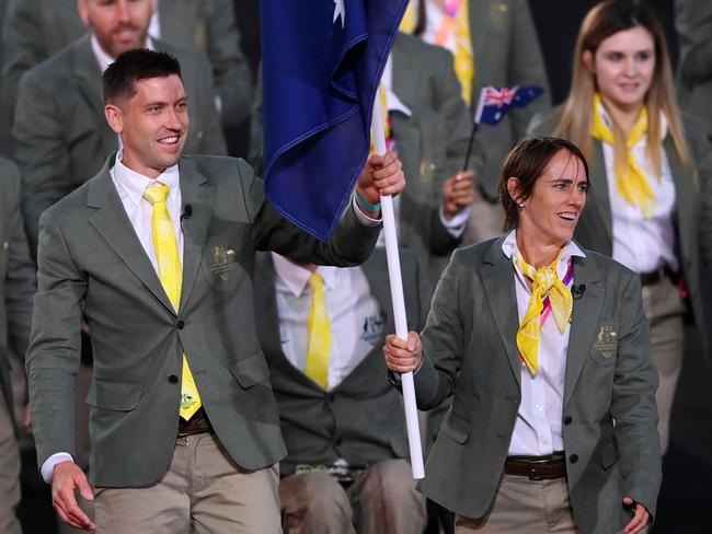 BIRMINGHAM, ENGLAND - JULY 28: Eddie Ockenden and Rachael Grinham, Flag Bearers of Team Australia lead their team out during the Opening Ceremony of the Birmingham 2022 Commonwealth Games at Alexander Stadium on July 28, 2022 on the Birmingham, England. (Photo by Alex Davidson/Getty Images)