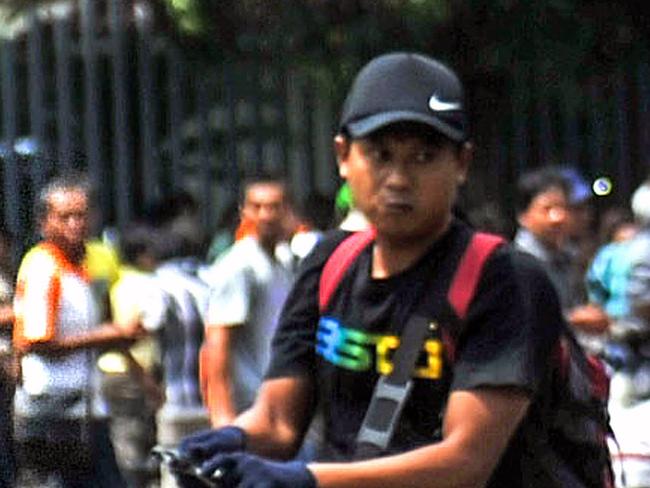 (FILES) This picture taken on January 14, 2016 shows Afif, who also uses the alias Sunakim, carrying his weapon on the street during attacks in the Indonesian capital Jakarta. Indonesia has identified one of five attackers in the deadly Jakarta violence as a previously-jailed militant whose picture snapped amid the mayhem went viral in the country as the grim face of Islamic extremism. Police say they have identified four of the five attackers, and late on January 15, released the first name, a militant named Afif. Many Indonesians go by a single name. CHINA OUT /HONG KONG OUT AFP PHOTO/XINHUA -----EDITORS NOTE---- RESTRICTED TO EDITORIAL USE - MANDATORY CREDIT "AFP PHOTO/XINHUA" - NO MARKETING NO ADVERTISING CAMPAIGNS - DISTRIBUTED AS A SERVICE TO CLIENTS