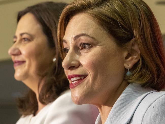 Queensland Premier Annastacia Palaszczuk and Treasurer Jackie Trad (right) speak during the state government's 2019-20 Queensland budget media briefing in Brisbane, Tuesday, June 11, 2019. (AAP Image/Glenn Hunt) NO ARCHIVING