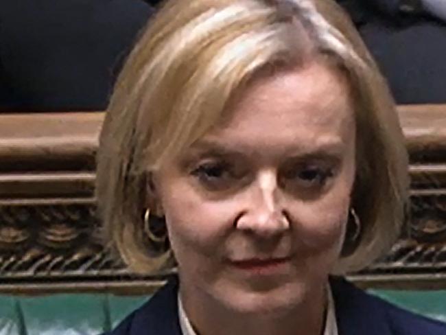 A video grab from footage broadcast by the UK Parliament's Parliamentary Recording Unit (PRU) shows Britain's Prime Minister Liz Truss reacting following Britain's Chancellor of the Exchequer Jeremy Hunt presentation of tax and spending measures, part of medium-term fiscal plan at the House of Commons, in London, on October 17, 2022. - The British government on October 17, 2022 axed almost all of its debt-fuelled tax cuts unveiled last month to avert fresh markets chaos, in a humiliating climbdown for embattled Prime Minister Liz Truss. The shock move by new finance chief Jeremy Hunt, parachuted into the job on Friday to replace sacked Kwasi Kwarteng, leaves Truss' position in a precarious state after a series of embarrassing U-turns. (Photo by PRU / AFP) / RESTRICTED TO EDITORIAL USE - MANDATORY CREDIT "AFP PHOTO / PRU " - NO MARKETING - NO ADVERTISING CAMPAIGNS - DISTRIBUTED AS A SERVICE TO CLIENTS