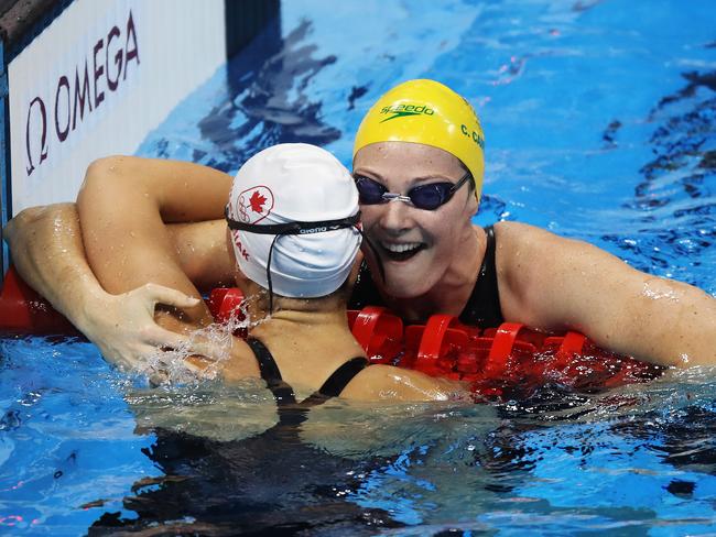 Australia's Cate Campbell celebrates her Olympic Record time in the Women's 100m Freestyle Semi final with Canada's Penny Oleksiak on day five of the swimmingat the Rio 2016 Olympic Games. Picture. Brett Costello