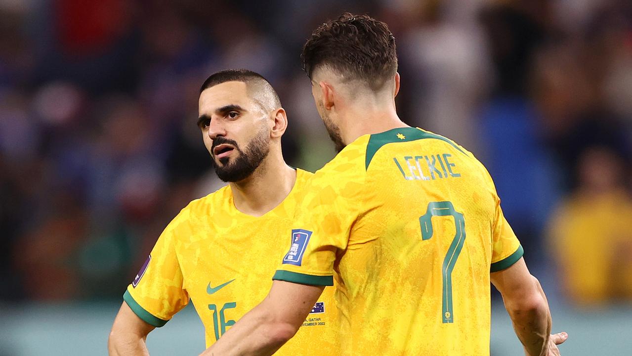AL WAKRAH, QATAR - NOVEMBER 22: Aziz Behich (L) and Mathew Leckie of Australia react after the 1-4 loss during the FIFA World Cup Qatar 2022 Group D match between France and Australia at Al Janoub Stadium on November 22, 2022 in Al Wakrah, Qatar. (Photo by Robert Cianflone/Getty Images)