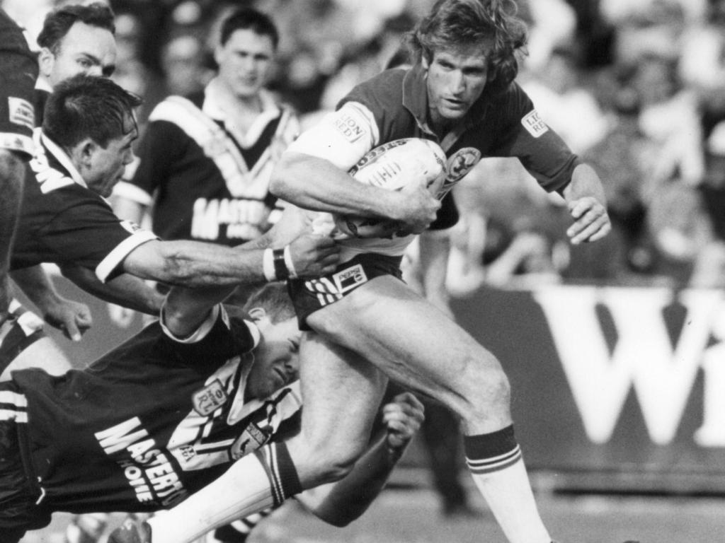 Des Hasler takes on the Magpies defence back in 1987.