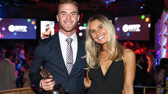 Tom Mitchell with his partner Hannah Davis after winning the Leigh Matthews Trophy.