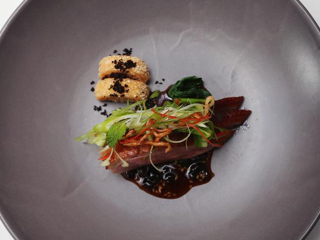 Ezard’s Chinese duck breast with Asian herb salad. Picture Rebecca Michael