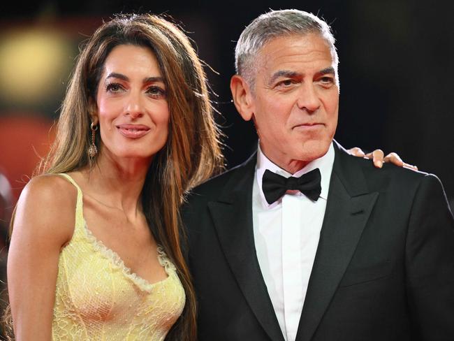 Actor George Clooney and his wife Amal Clooney attend the red carpet of the movie "Wolfs" presented out of competition during the 81st International Venice Film Festival at Venice Lido. Picture: AFP