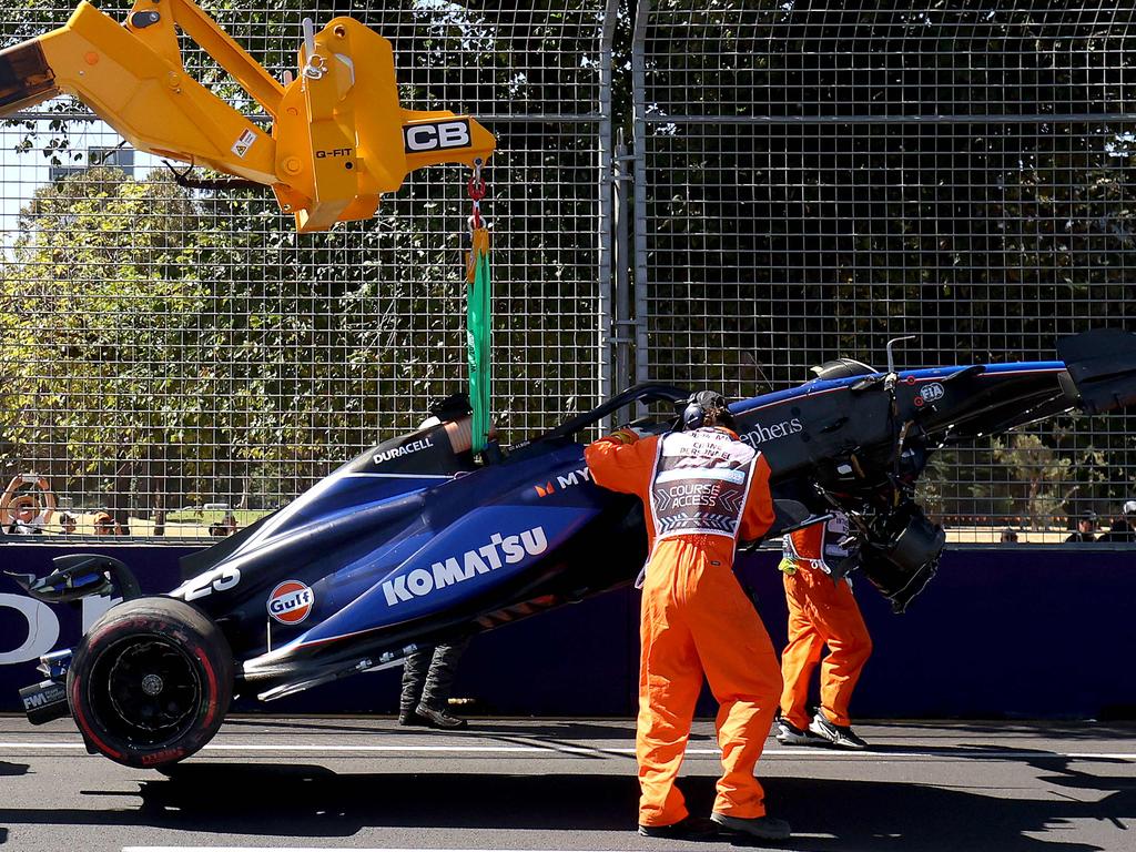 Marshals remove Alexander Albon’s Williams after his crash. Picture: AFP