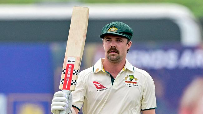 Australia's vice captain Travis Head celebrates after scoring a half-century (50 runs) during the first day of the first Test cricket match between Sri Lanka and Australia at the Galle International Cricket Stadium in Galle on January 29, 2025. (Photo by Ishara S. KODIKARA / AFP)