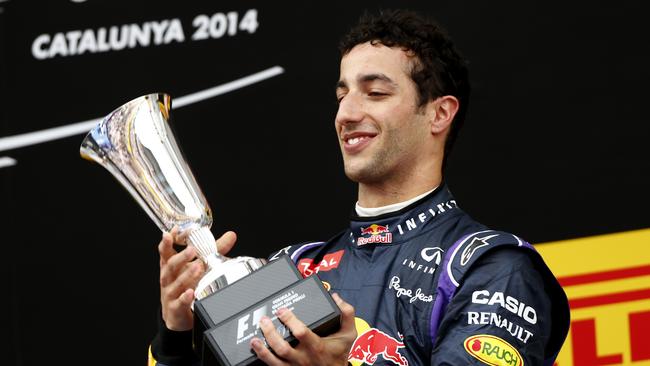 Australia’s Daniel Ricciardo lifts the trophy for third place after the Spanish Formula One Grand Prix.