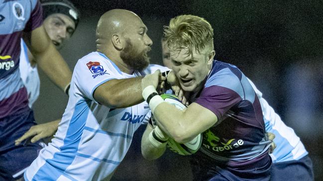 ISaac Lucas takes on the Waratahs defence in a Super Rugby trial in Dalby. QRU Media