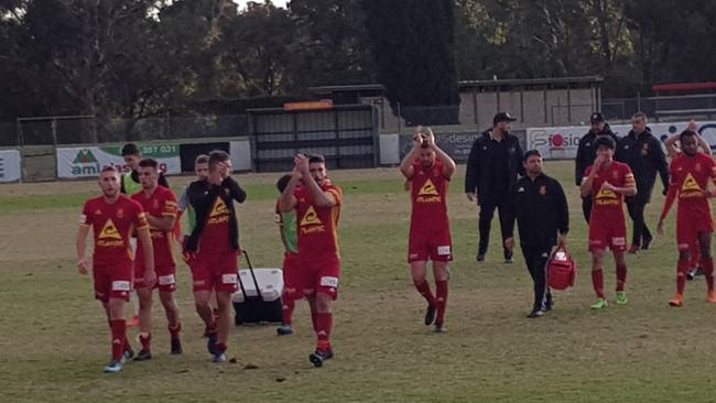 Preston Lions players leave the pitch after their State League 1 North-West win over Yarraville FC. Picture: Tim Michell.