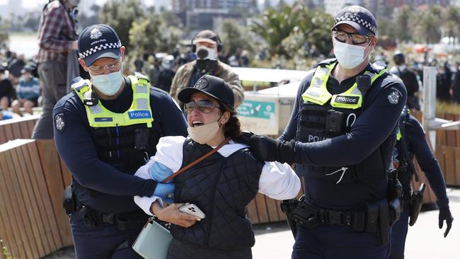 This woman was led away by police. Picture: Alex Coppel.