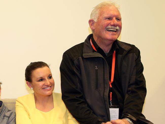 Palmer United Party Senator Jacqui Lambie's sons Brentyn and Dylan Milverton, her nephew Jet Lambie and Jacqui Lambie and her father Tom in her office after delivering her maiden speech in the Senate Chamber at Parliament House in Canberra.