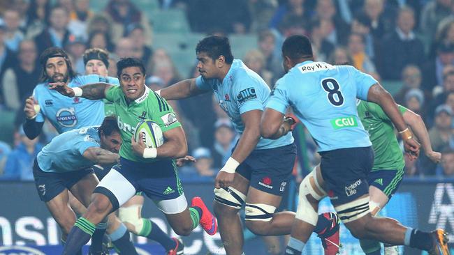 Malakai Fekitoa of the Highlanders runs the ball against the Waratahs.