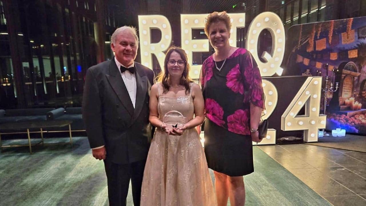 Sarah Moxon with Bronwyn and Lachlan Evans at the REIQ awards.