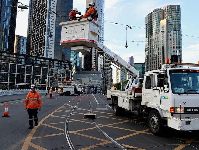 Authorities work to fix powerlines that were hit by a truck. Picture: Nicole Garmston