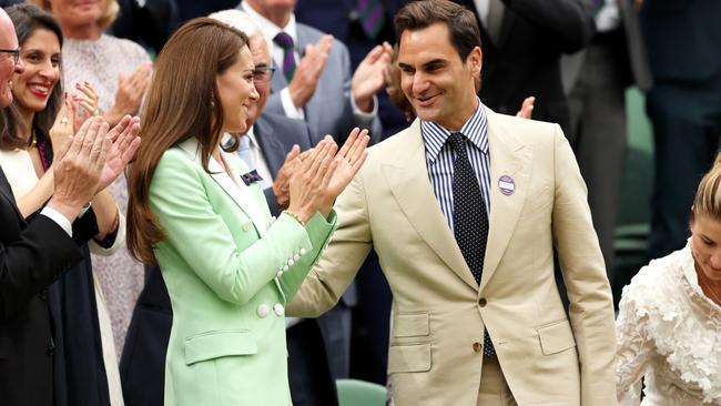 Roger Federer touches the Princess of Wales on her back, breaking royal protocol. Picture: Getty Images.