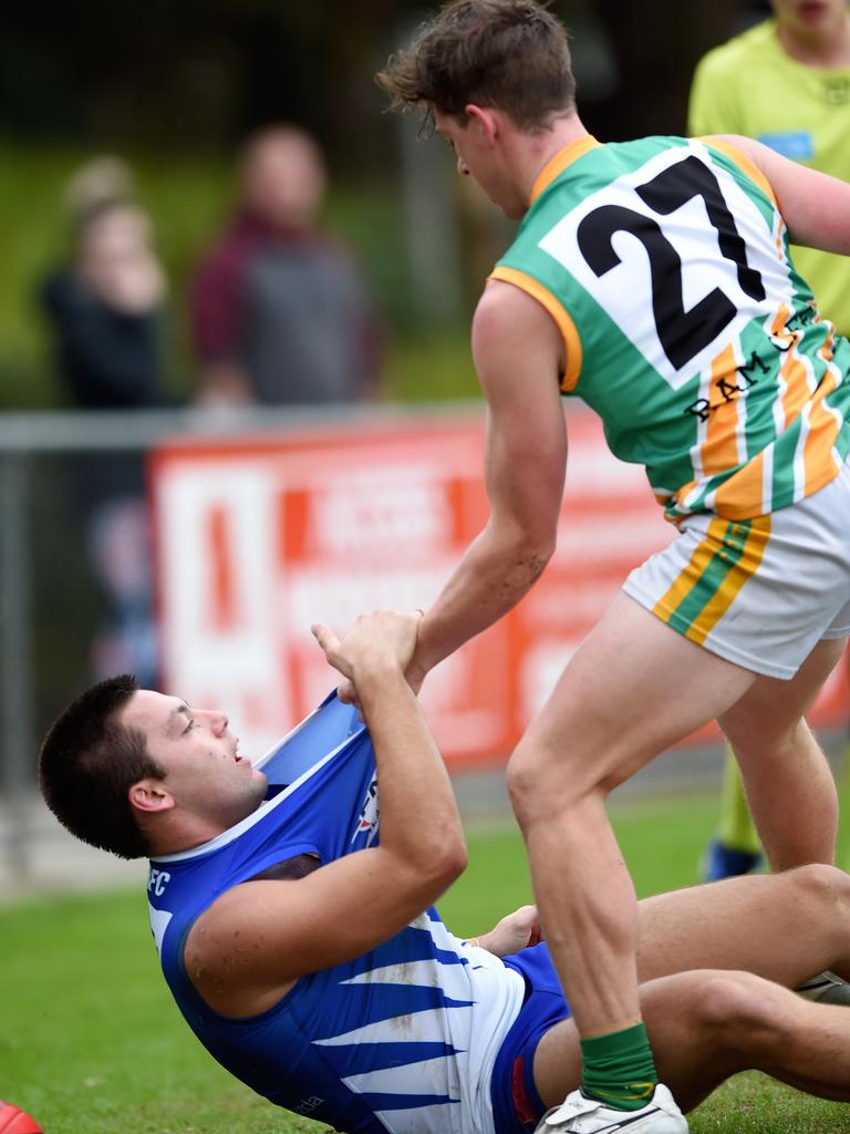 Eastern: Mooroolbark’s Lachlan Sutherland stands over East Ringwood’s Mitchell Walch. Picture: Steve Tanner