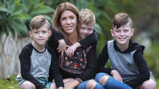 Rachel Tanner and her sons Flynn, 6, Oliver, 4, and Harper, 8, at home in Engadine.  Picture: Justin Lloyd