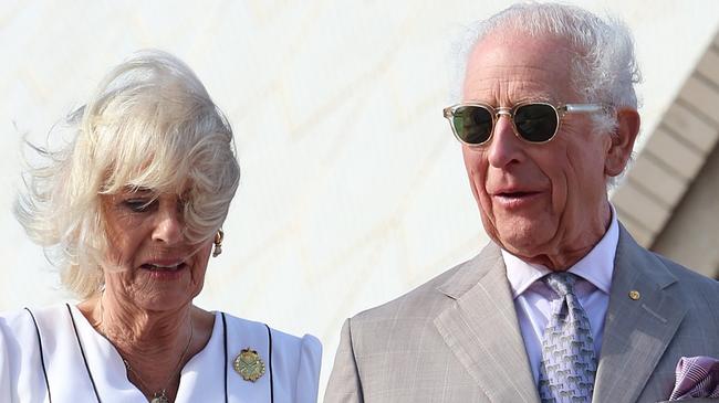 SYDNEY, AUSTRALIA - OCTOBER 22: King Charles III and Queen Camilla walk down the steps at the Sydney Opera House on October 22, 2024 in Sydney, Australia. The King's visit to Australia is his first as monarch, and the Commonwealth Heads of Government Meeting (CHOGM) in Samoa will be his first as head of the Commonwealth. (Photo by Chris Jackson/Getty Images)