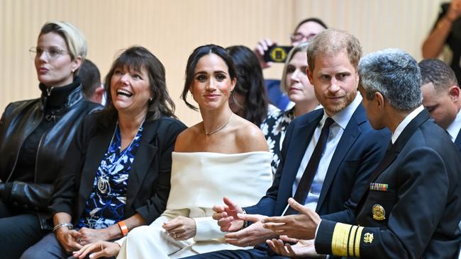 Meghan Markle and Prince Harry talk to the US Surgeon General, Dr. Vivek H. Murthy, about mental health. Picture: Getty Images