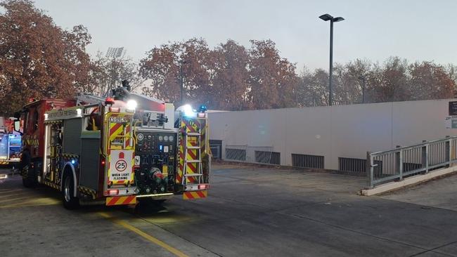 Emergency services at an underground Norwood carpark after car busts into flames. Picture: SA Police