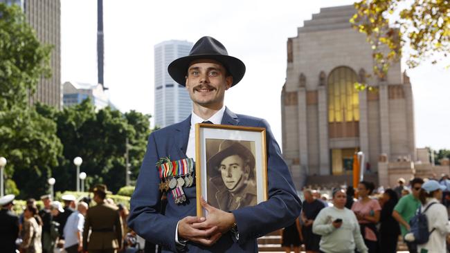 Simon Colagiuri with a photo of great grandfather who fought in WWII. Picture: Richard Dobson