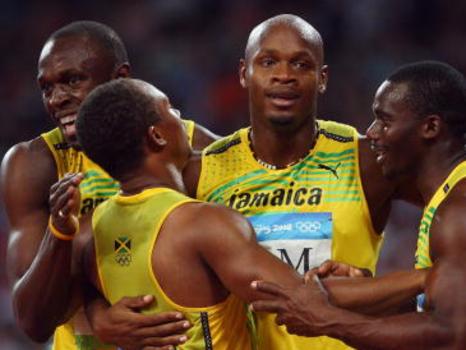 BEIJING - AUGUST 22: Asafa Powell, Nesta Carter, Usain Bolt and Michael Frater of Jamaica celebrate the gold medal after the Men's 4 x 100m Relay Final at the National Stadium on Day 14 of the Beijing 2008 Olympic Games on August 22, 2008 in Beijing, China. (Photo by Michael Steele/Getty Images)