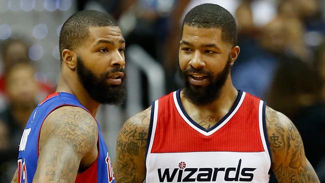 Marcus Morris talks with his twin brother Markieff Morris.