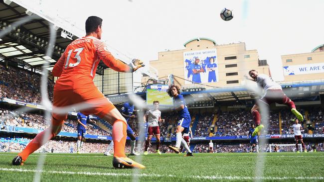 Sam Vokes scores one of Burnley’s three goals in their merited win over Chelsea.