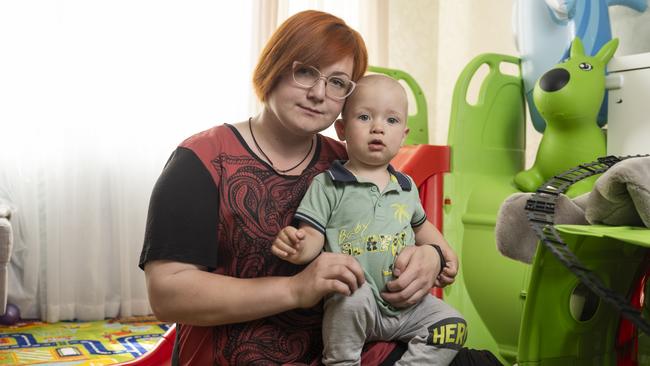 Svitlana Soldatova whose husband Vitaly was killed last year, with their son at the playroom of their family apartment in Dnipro. Picture: Sasha Maslov