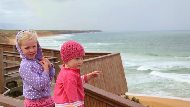 The viewing platform at Logans Beach in Warrnambool is a popular spot for whale-watching in early spring. Amelia Tucker (left) and sister Layla look out for whales. Picture: Hamish Blair