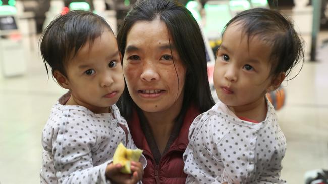 Nima and Dawa Pelden with mum Bhumchu before they leave Melbourne for home in Bhutan. Picture: AAP/David Crosling