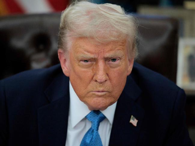 WASHINGTON, DC - JANUARY 31: U.S. President Donald Trump talks to reporters after signing an executive order, "Unleashing prosperity through deregulation," in the Oval Office on January 31, 2025 in Washington, DC. Trump spoke to reporters about tariffs against China, Canada and Mexico and how the newly confirmed Interior Secretary Doug Burghum will coordinate with the Energy Department and the Environmental Protection Agency.   Chip Somodevilla/Getty Images/AFP (Photo by CHIP SOMODEVILLA / GETTY IMAGES NORTH AMERICA / Getty Images via AFP)