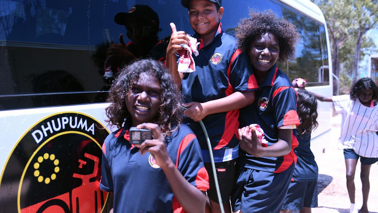 Jasmine Yunipingu, Richard Williams and Nikesha Mununggur with the new school bus. Picture: Amanda Parkinson