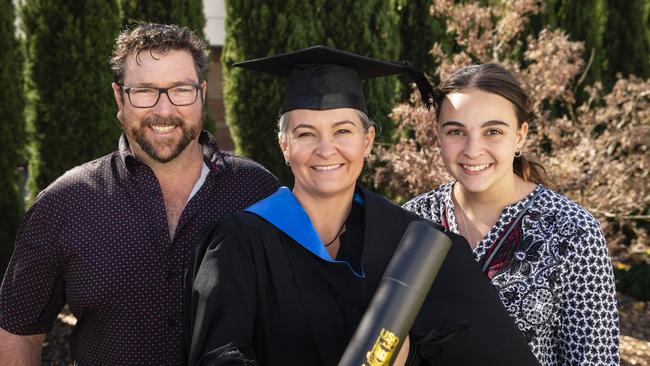 Bachelor of Nursing graduate Samantha Cochrane is congratulated by Steve Hannay and Cadence Cochrane at a UniSQ graduation ceremony at Empire Theatres, Wednesday, June 28, 2023. Picture: Kevin Farmer